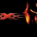 Vin Diesel as Xander Cage in xXx movie performing a daring stunt - action thriller film poster