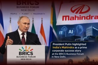 Vladimir Putin speaking at the BRICS Business Forum in New Delhi alongside Mahindra branding and visuals representing IT, AI, and Indian industry.